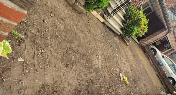 setting the ground ready to pour concrete for sidewalk installation in Bronx
